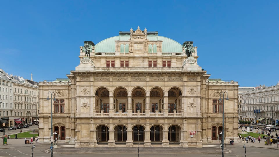 The front facade of the Vienna State Opera house on a clear day