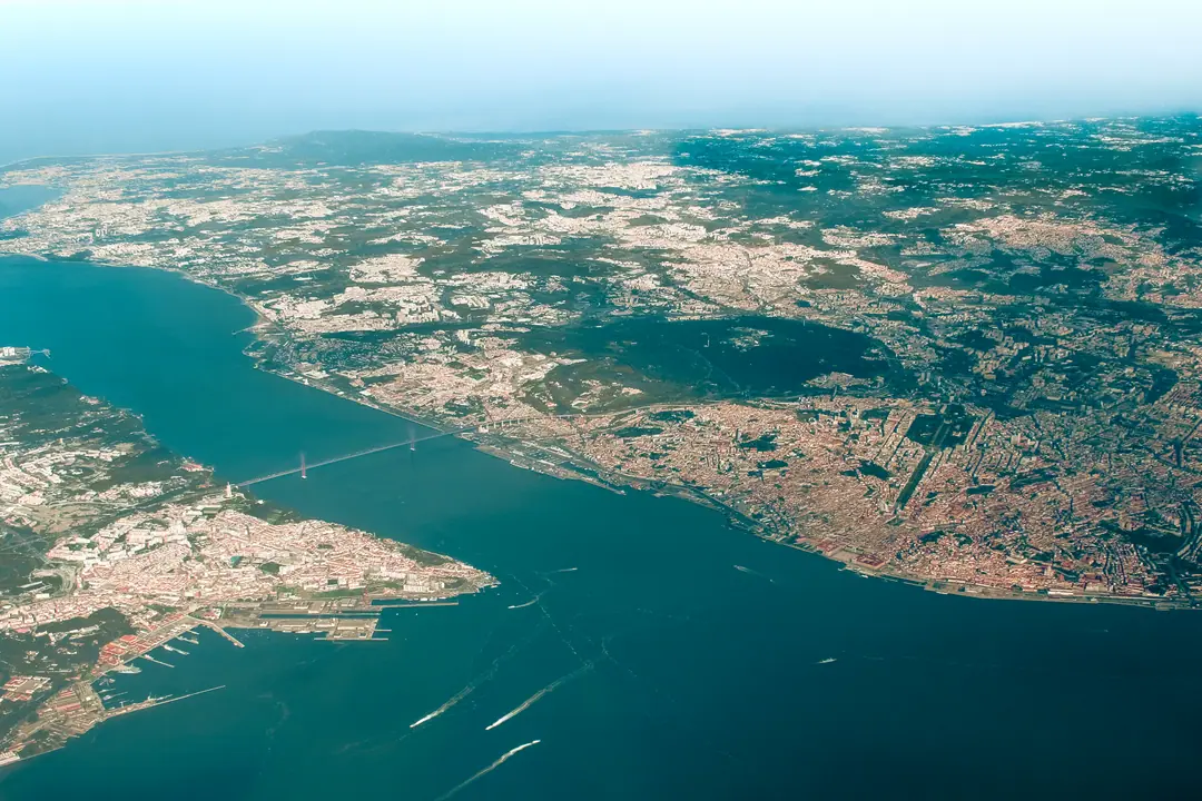 Aerial view of the Tagus river, Ponte 25 de Abril and central Lisbon