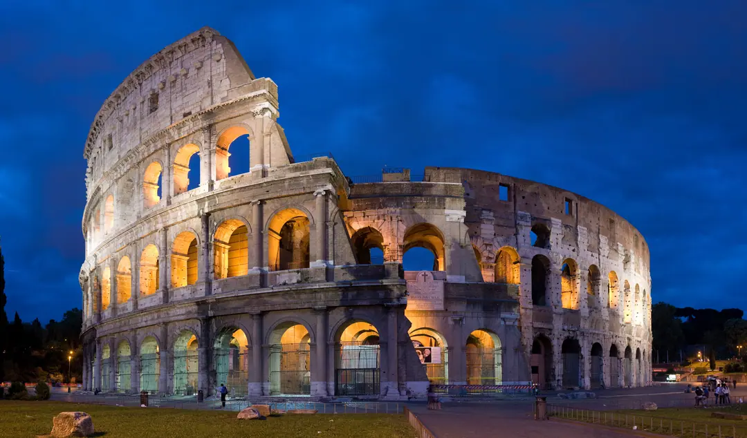 The Colosseum in Rome seen from outside its ancient arena walls at golden hour