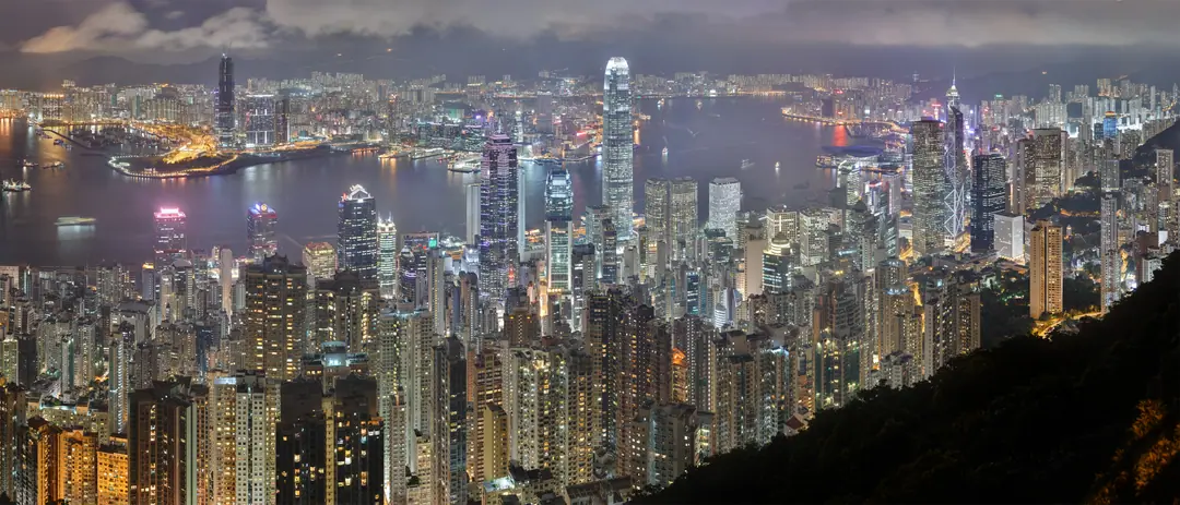 Victoria Harbour and the Hong Kong Island skyline at night, seen from Lugard Road on Victoria Peak